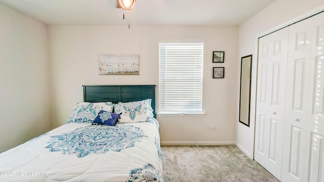 carpeted bedroom with a closet