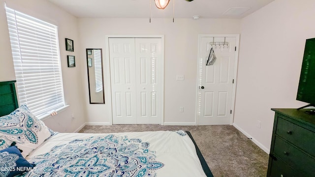 carpeted bedroom featuring a closet