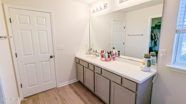 bathroom with vanity and hardwood / wood-style floors