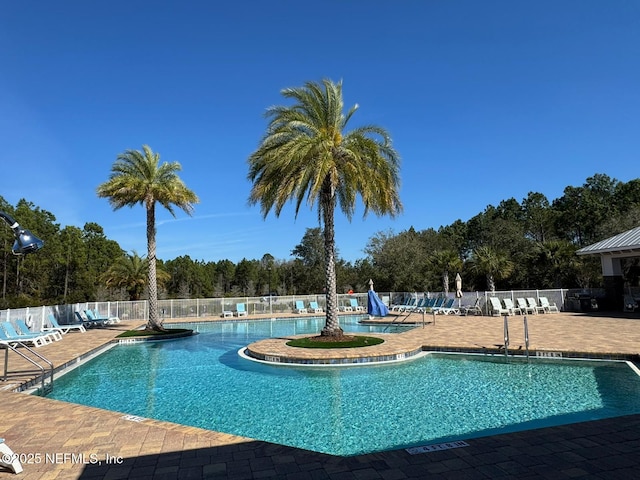 view of swimming pool featuring a patio area