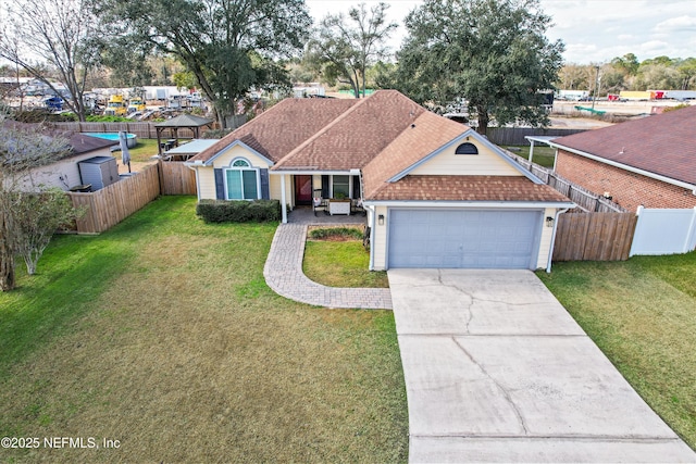 ranch-style house with a garage and a front yard