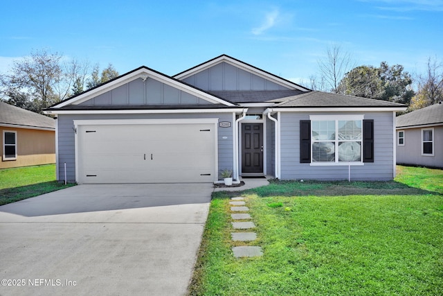 view of front of property featuring a garage and a front yard