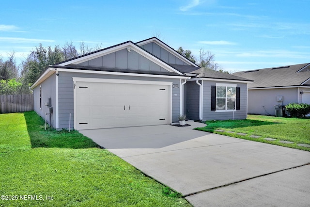 ranch-style home featuring a garage and a front yard