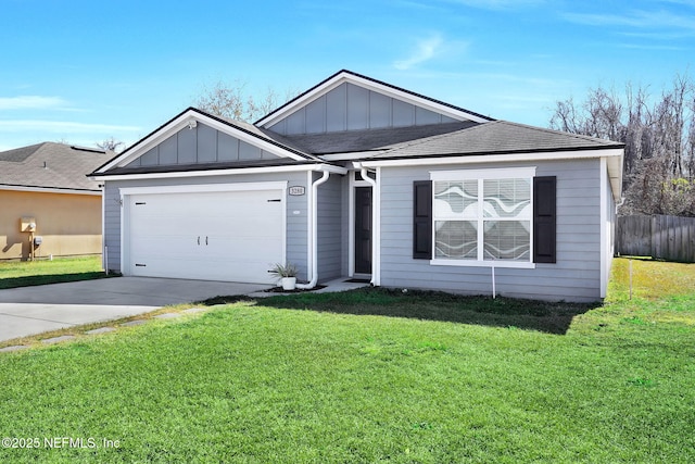 view of front of house with a garage and a front lawn