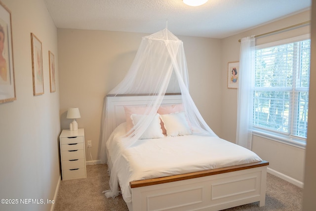 bedroom with light carpet and multiple windows