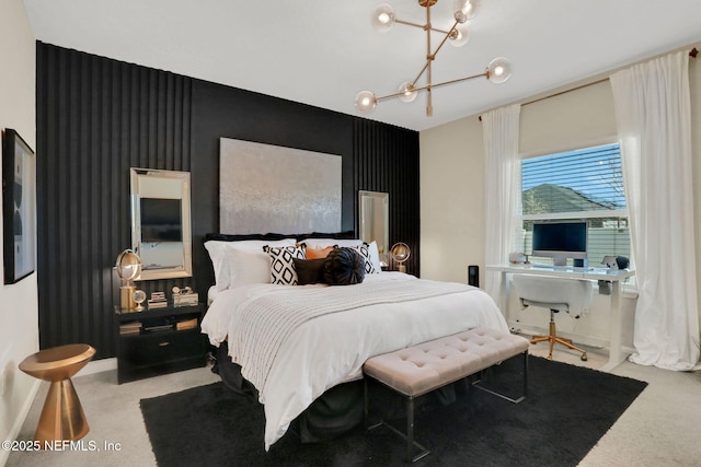 carpeted bedroom with a notable chandelier