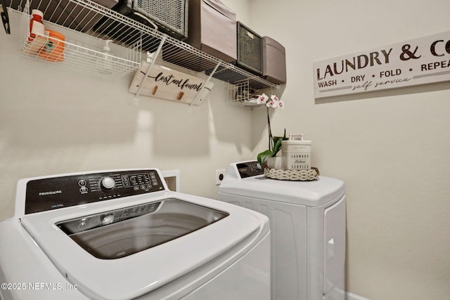 laundry room with washing machine and dryer