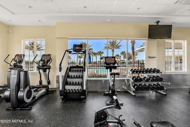 exercise room with a drop ceiling