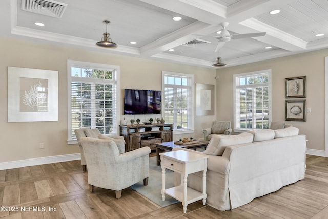 living room with beamed ceiling, coffered ceiling, a wealth of natural light, and crown molding