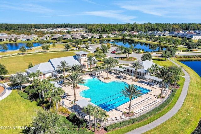 birds eye view of property with a water view