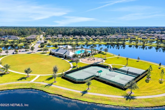 birds eye view of property with a water view