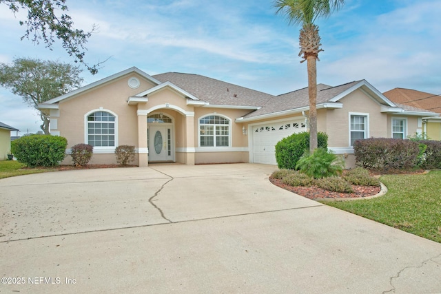 ranch-style home with a garage