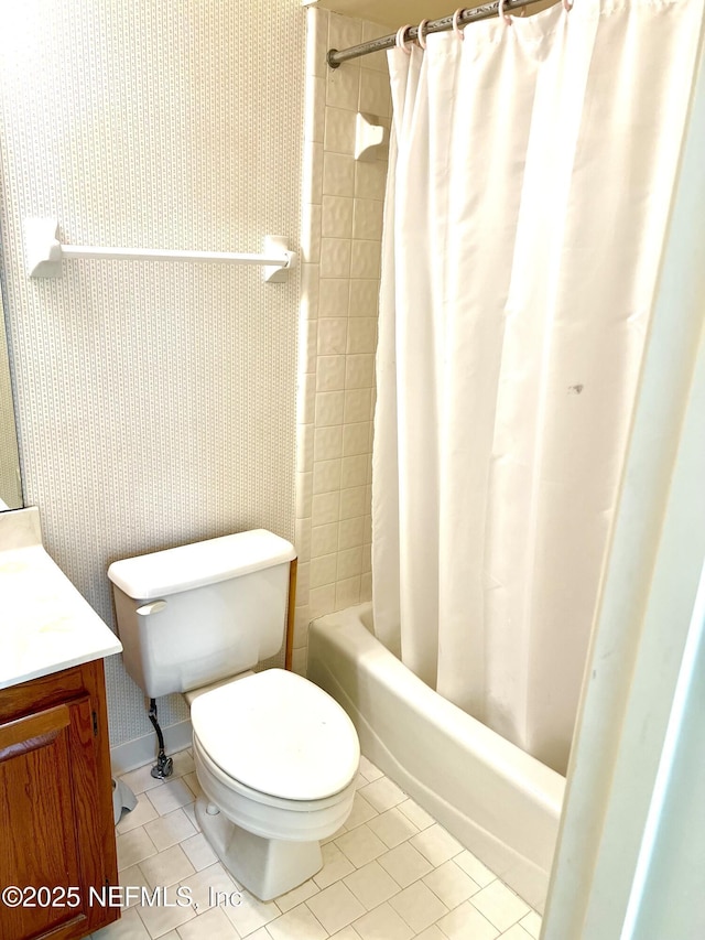 full bathroom featuring vanity, shower / bath combo, tile patterned floors, and toilet