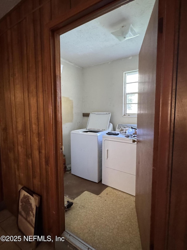 laundry area featuring washing machine and clothes dryer