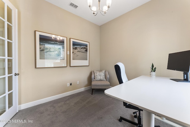 office space featuring carpet flooring and a notable chandelier