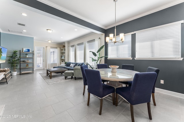 tiled dining area featuring an inviting chandelier and crown molding