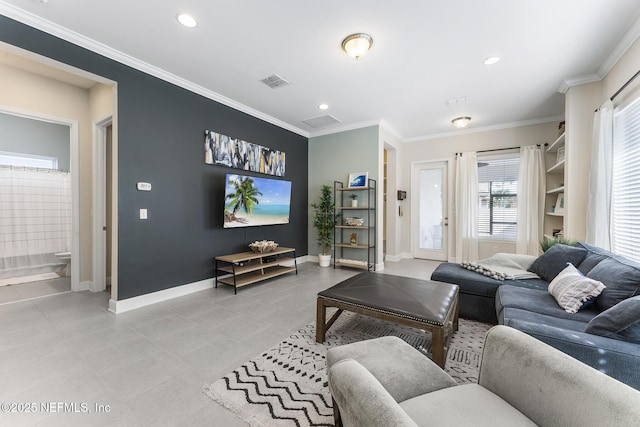 tiled living room featuring ornamental molding