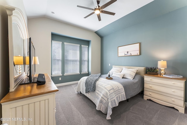 bedroom featuring lofted ceiling, ceiling fan, and dark colored carpet