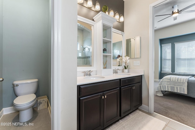 bathroom featuring vanity, ceiling fan, tile patterned floors, and toilet