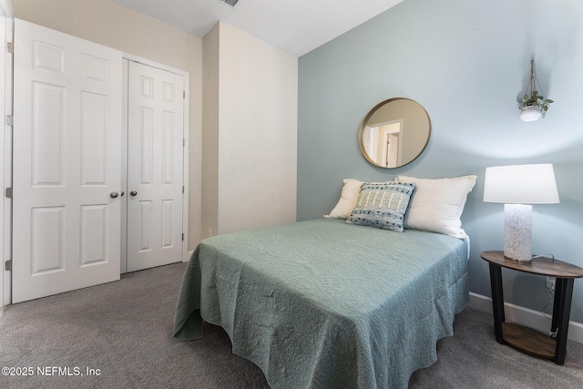 carpeted bedroom with a closet