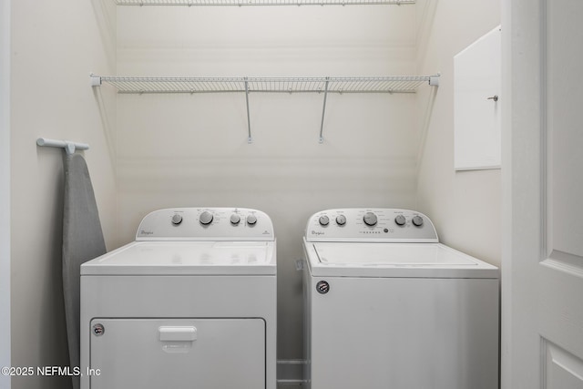 washroom featuring washer and dryer