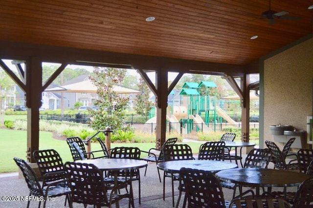 view of patio / terrace featuring a playground and ceiling fan