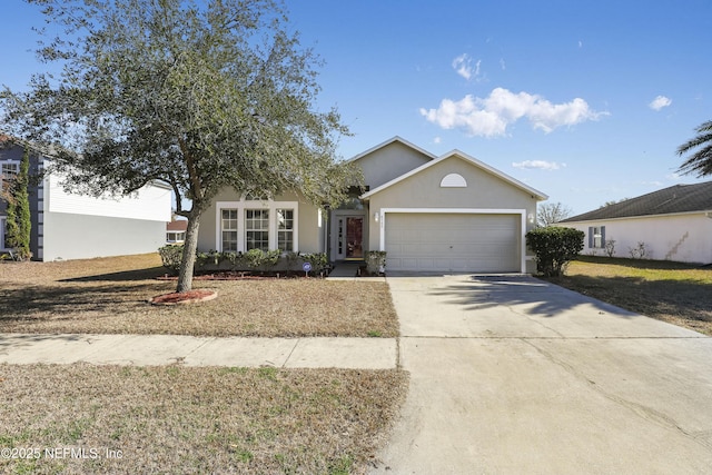 view of front of home with a garage and a front yard