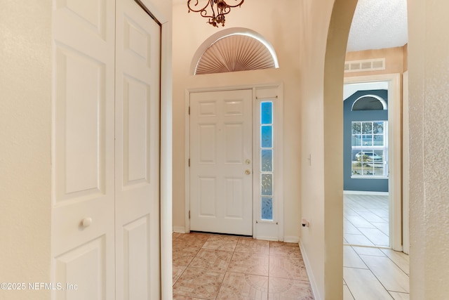 foyer with light tile patterned floors