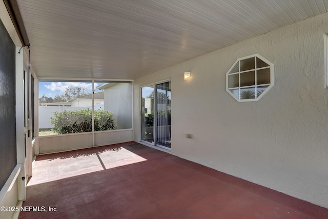 unfurnished sunroom with a healthy amount of sunlight