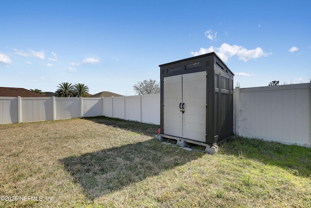 view of outdoor structure featuring a lawn