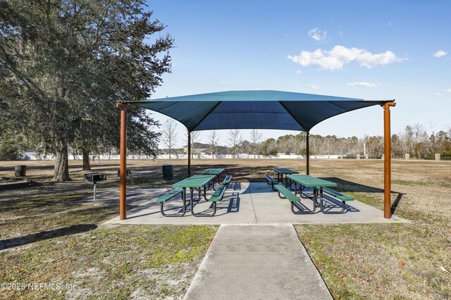 view of home's community featuring a yard and a playground