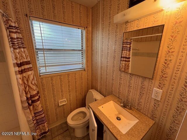 bathroom with vanity, tile patterned floors, toilet, and a shower with shower curtain