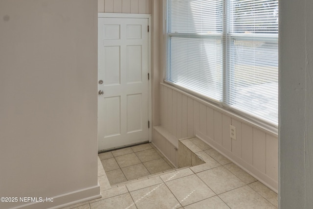 interior space with light tile patterned floors