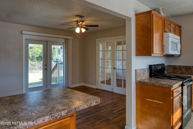 kitchen featuring french doors, dark wood-type flooring, a textured ceiling, ceiling fan, and black range with electric stovetop