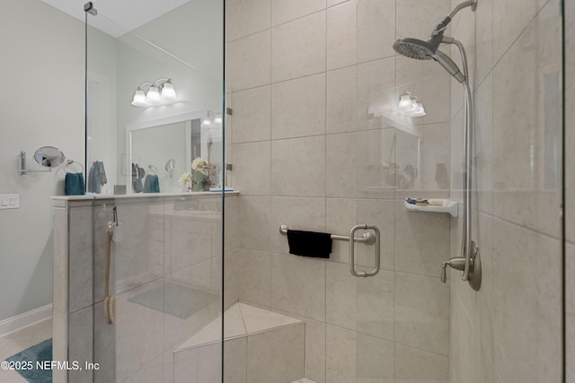 bathroom with a shower with shower door