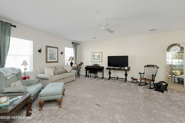 living room with light carpet and ceiling fan