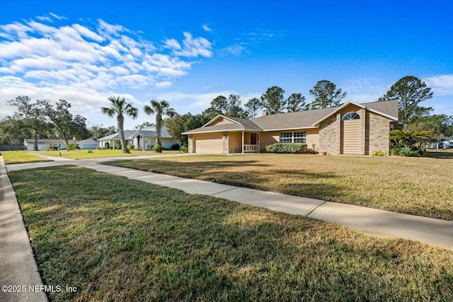 ranch-style home with a garage and a front yard