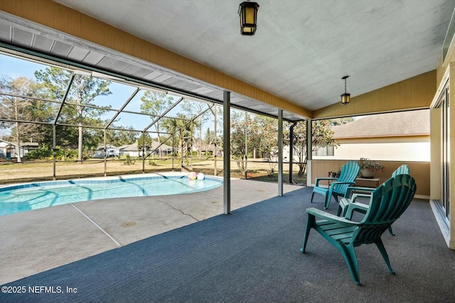 view of swimming pool featuring a lanai and a patio