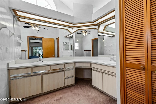 bathroom with vanity, lofted ceiling, and ceiling fan