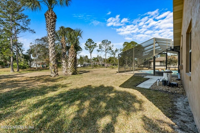 view of yard featuring a lanai