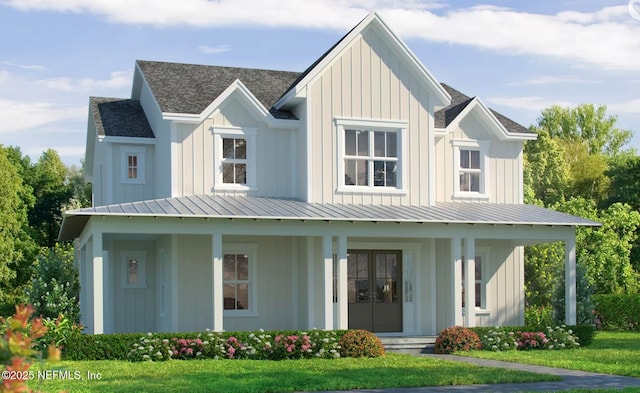 modern farmhouse style home featuring a front yard and covered porch