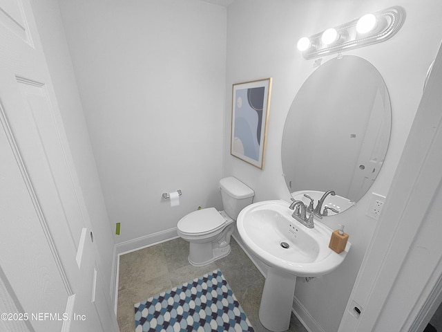 bathroom with toilet and sink