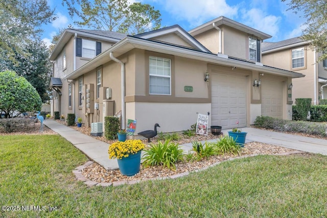 view of front of house featuring a garage and a front lawn