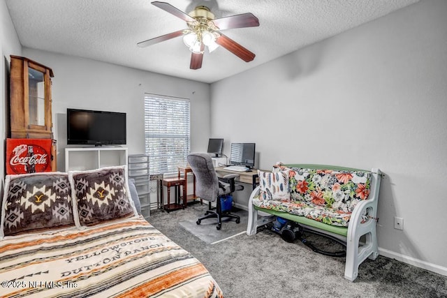 office space with ceiling fan, carpet, and a textured ceiling