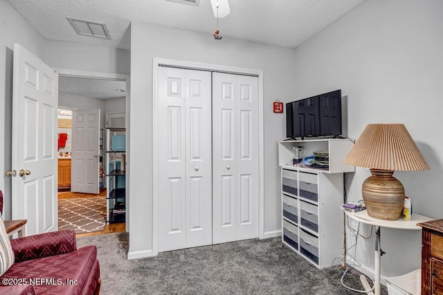 interior space featuring a textured ceiling