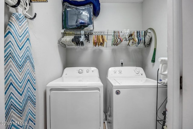 laundry room featuring separate washer and dryer