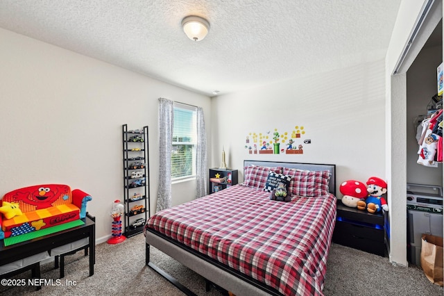 carpeted bedroom featuring a textured ceiling