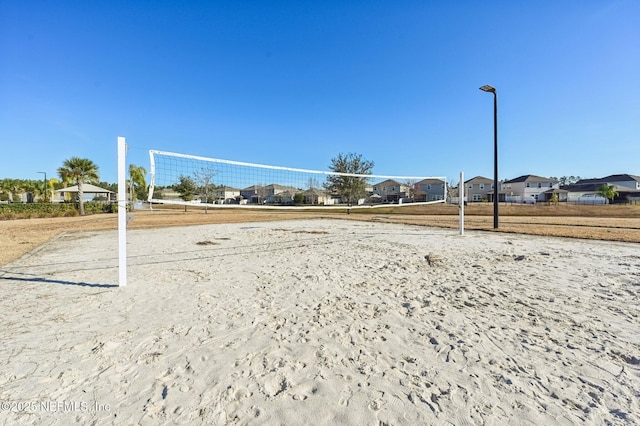 view of property's community featuring volleyball court