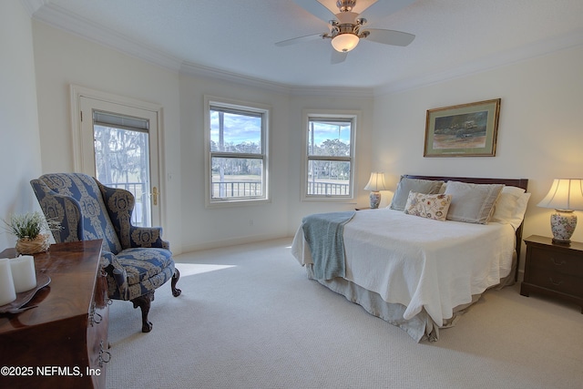 bedroom with crown molding, ceiling fan, light colored carpet, and access to outside