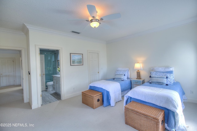 bedroom with ornamental molding, light carpet, connected bathroom, and ceiling fan